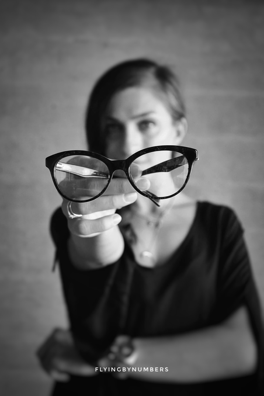 Lady holding glasses