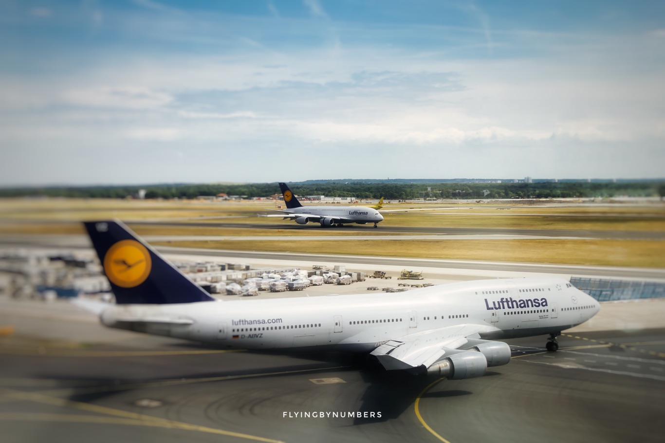 Lufthansa 747 alongside a landing a380, the two aircraft with the largest amount of flight attendants required