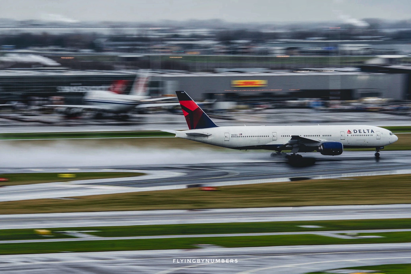 Delta aircraft landing in rain