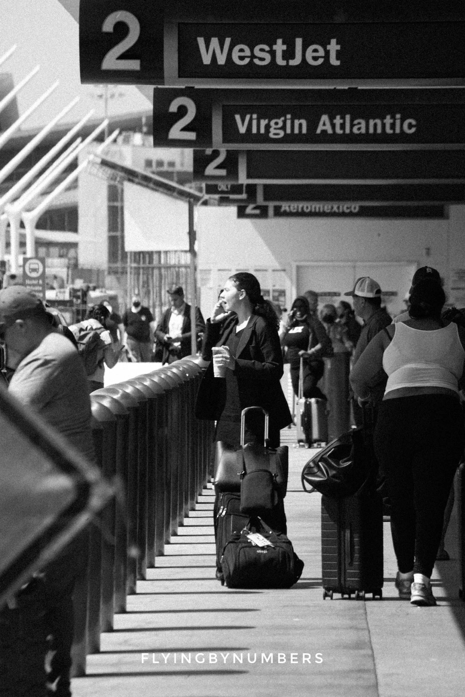 Flight attendant waits at an airport after a long flight