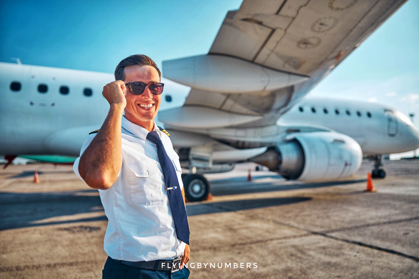Smiling pilot with sunglasses