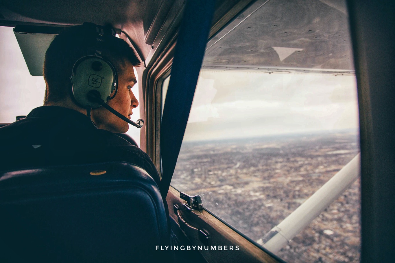 Student pilot looking out of the window during flight training