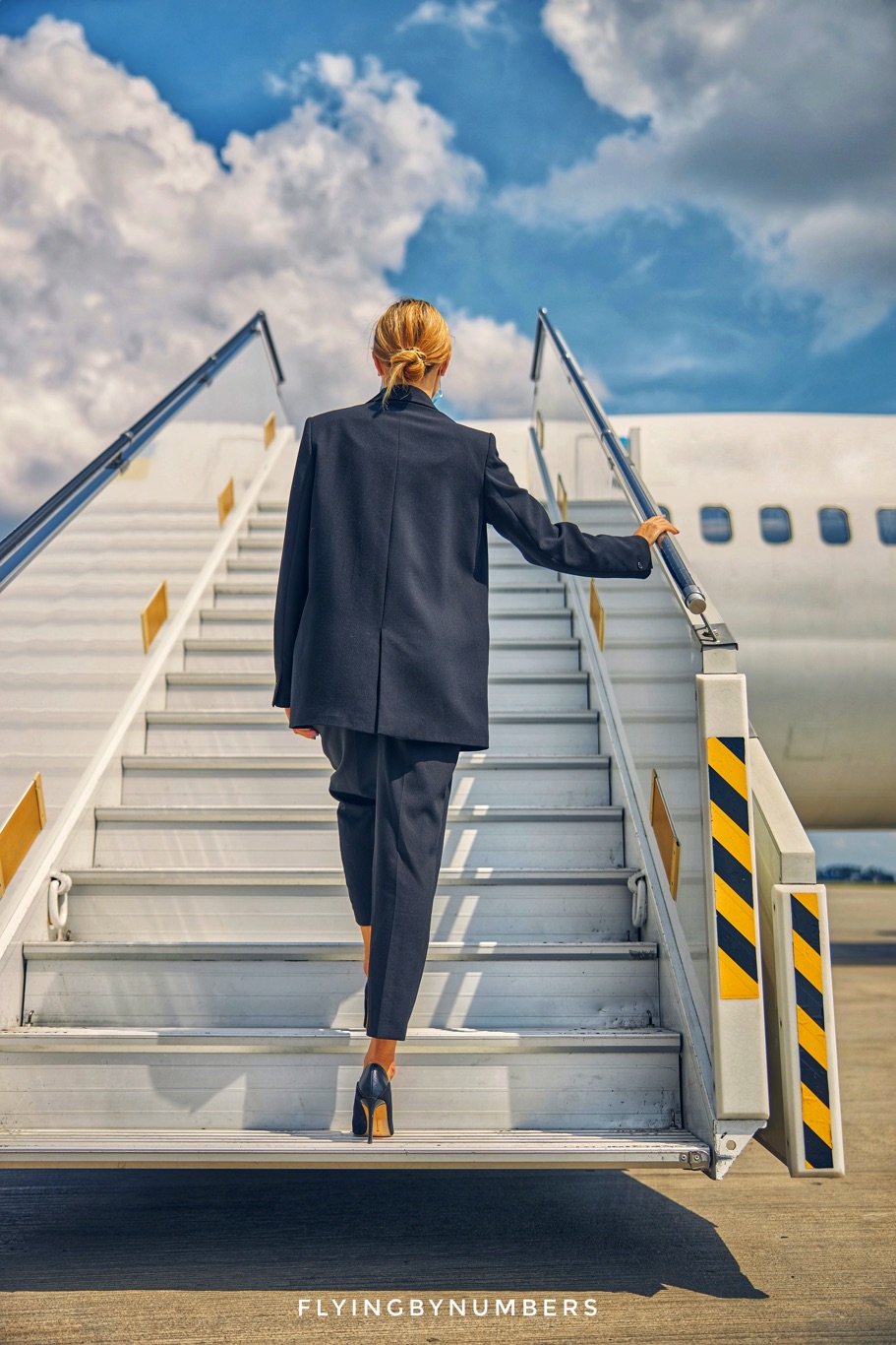 Flight attendant boarding an aircraft wearing high heels
