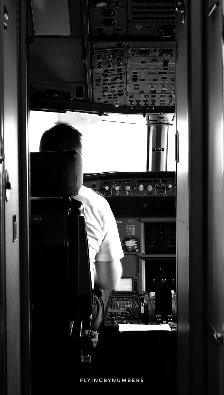 Single pilot alone in commercial airline cockpit