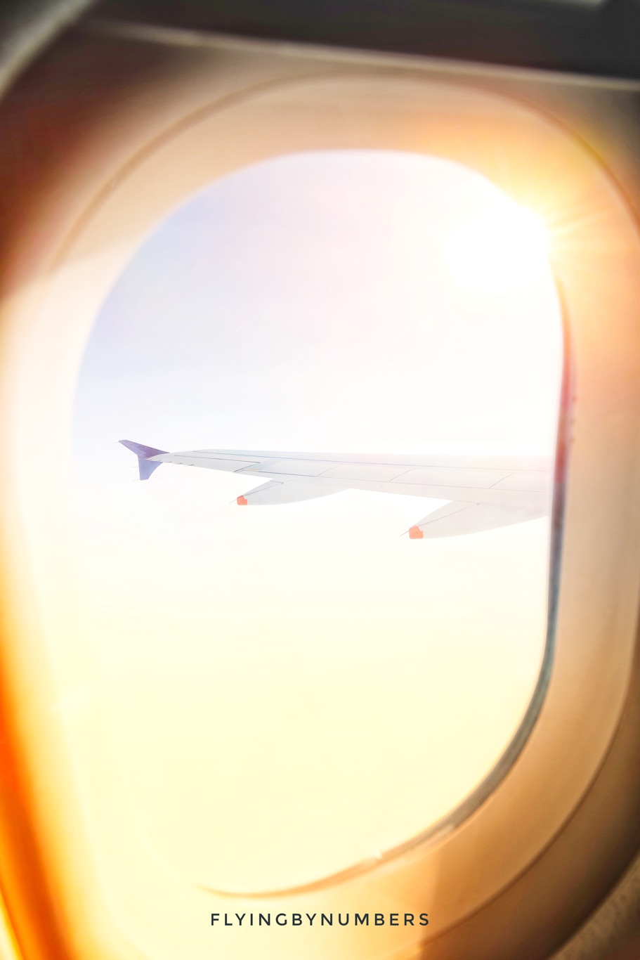 passengers in a sunny airplane window needing sunscreen
